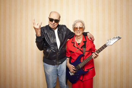 cool fashion elder couple with electric guitar